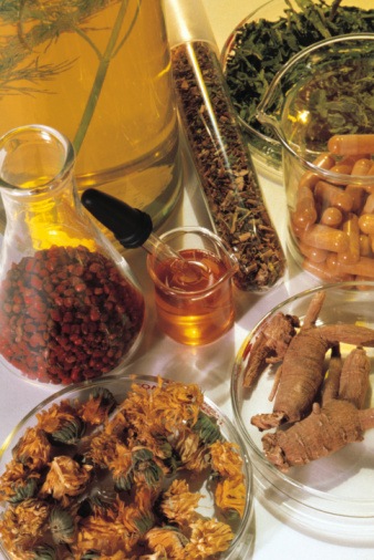 Various herbs in beakers and flasks